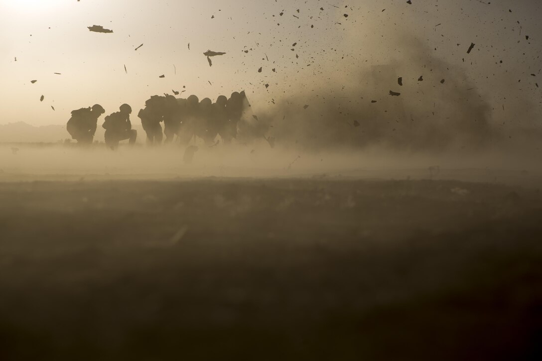 U.S. Marines with 2nd Battalion, 6th Marine Regiment and 2nd Combat Engineer Battalion, take cover from shrapnel behind a blast blanket while conducting urban demolition breach training for Talon Exercise 2-17, Yuma, Arizona, March 30, 2017. The purpose of TalonEx was for ground combat units to conduct integrated training in support of the Weapons and Tactics Instructor Course 2-17 hosted by Marine Aviation Weapons and Tactics Squadron One.