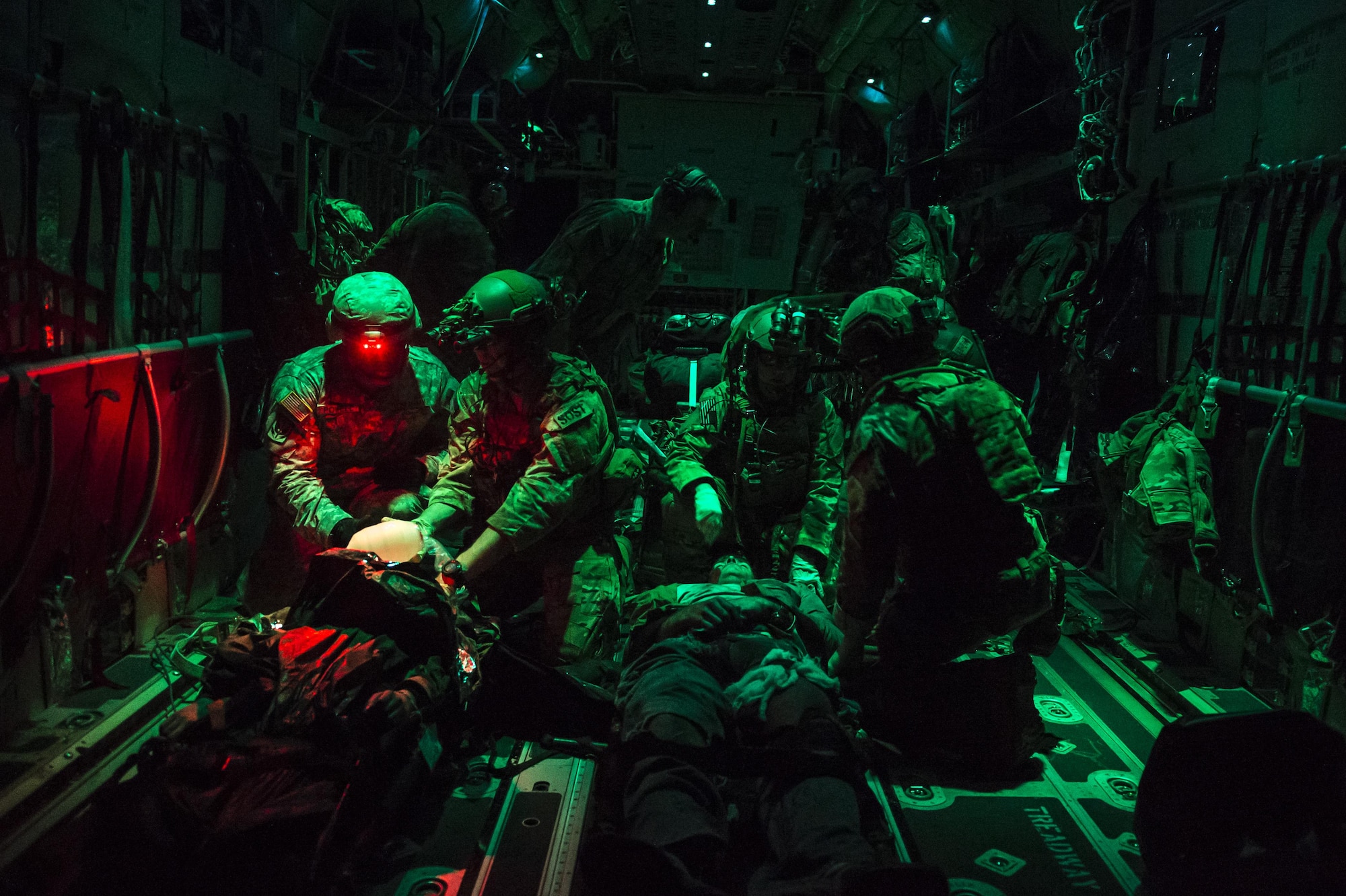 A U.S. Air Force Special Operations Surgical Team from the 720th Operations Support Squadron secure patients on an MC-130J Commando II during Emerald Warrior 17 at Hurlburt Field, Fla., March 2, 2017. Emerald Warrior is a U.S. Special Operations Command exercise during which joint special operations forces train to respond to various threats across the spectrum of conflict. (U.S. Air Force photo by Airman 1st Class Keifer Bowes)