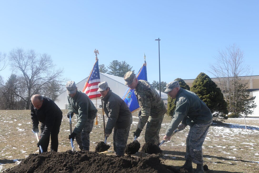 Col. Barron and the rest of the official party break ground on the Hanscom Air Force Base Dormitory construction, March 13, 2017.