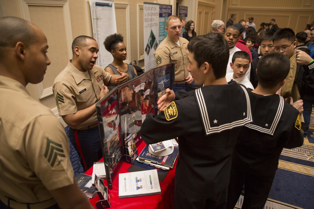 Marines from Recruiting Substation Landover speak to middle and high school Science, Technology, Engineering and Mathematics students during the Navy League STEM Exposition at the Gaylord National Convention Center, in Oxon Hill, Md., April 2, 2017. The STEM convention brings together large organizations to motivate young adults to continue their educational growth.
