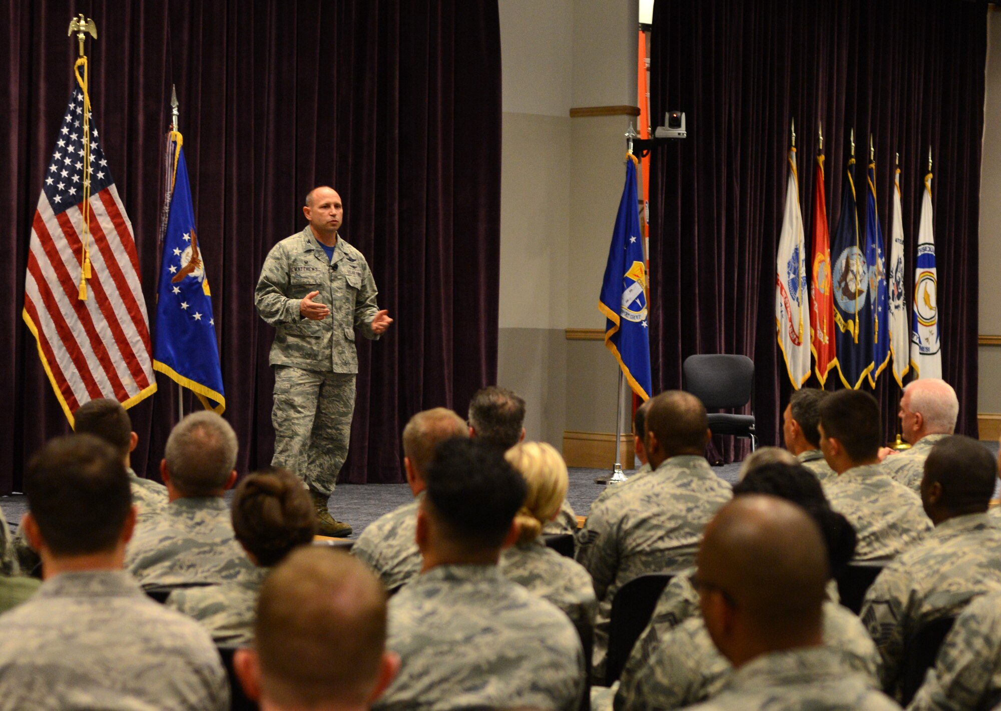 Col. Kurt Matthews, 920th Rescue Wing commander, speaks to Reserve Airmen during his first commander's call April 2, 2017 at Patrick Air Force Base, Fla. Matthews took command of the Air Force Reserve's only combat search-and-rescue wing in December 2016. (U.S. Air Force photo by Staff Sgt. Jared Trimarchi)