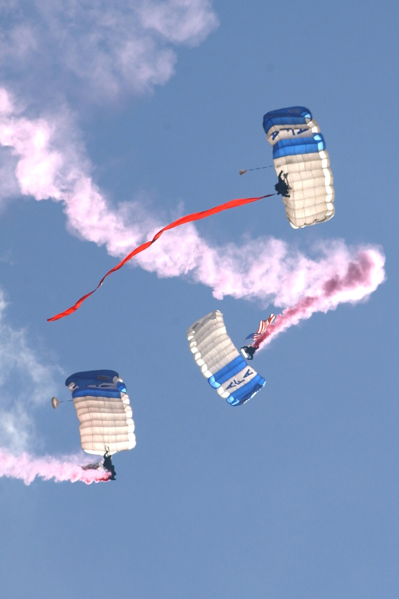 Wings of Blue team members parachute in to a Falcon Stadium home game during pregame ceremonies at the U.S. Air Force Academy. The Academy parachute team will bring in the U.S. flags at the Texas Rangers home opener in Arlington, Texas, April 3, 2017. (U.S. Air Force photo/John Van Winkle)

