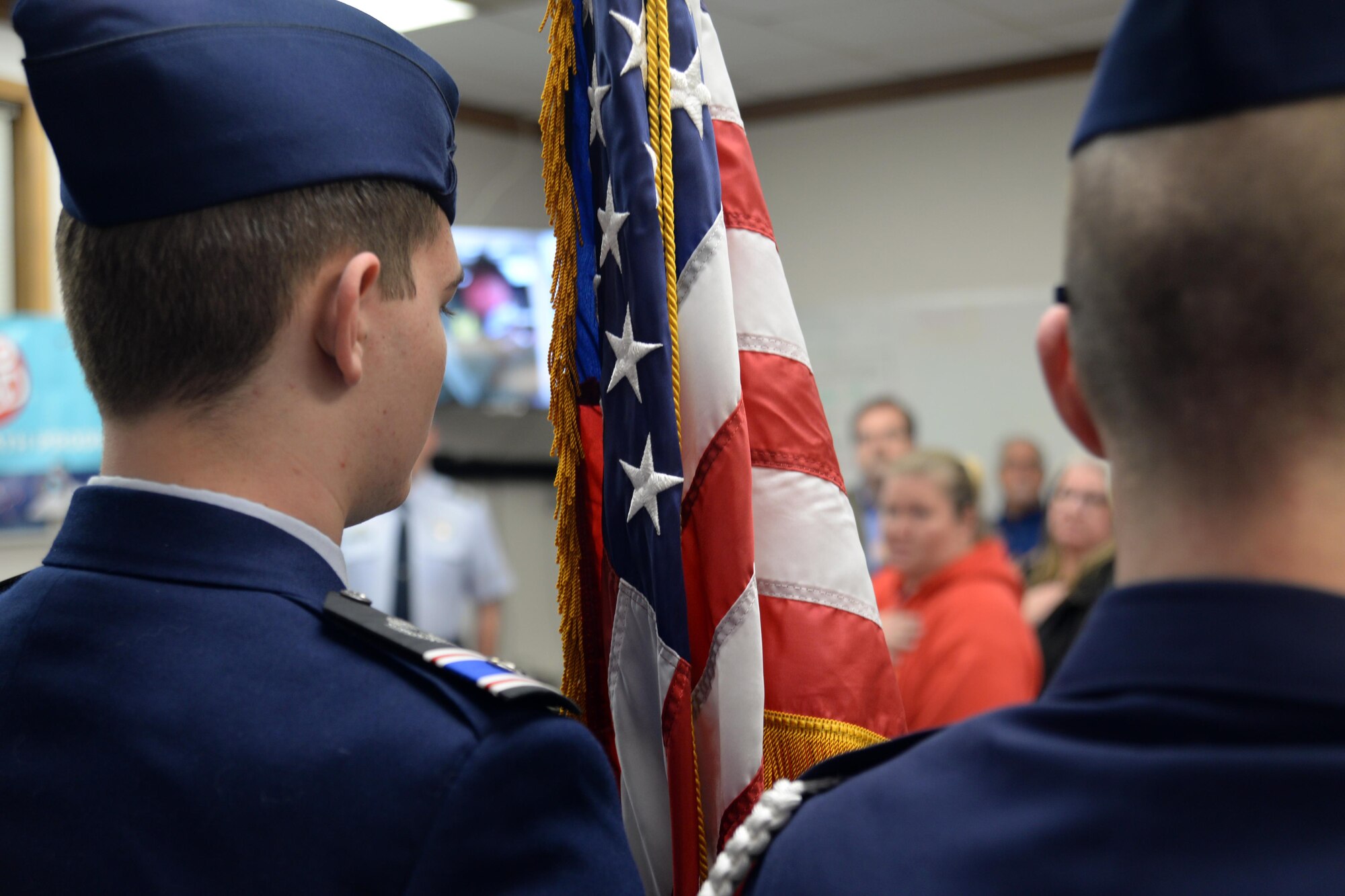 Cadet 2nd Lt. James Crayton (left) and Cadet Chief Master Sgt. Any Robichaux (right) present the colors at the Curtis E. LeMay Composite Squadron's open house March 30 at their squadron headquarters. The event showcased a new state-of-the-art cybersecurity and science, technology, engineering and mathematics (STEM) learning environment made possible by grants from a local corporate sponsor, the Offutt Officers’ Spouses’ Club and an anonymous donor. 

About 56,000 members make up CAP, which celebrated 75 years of service on Dec. 1, 2016, and consists of eight geographical regions, composed of 52 separate wings, one in each state, and Washington D.C. and Puerto Rico. The organization operates a fleet of 550 aircraft and performs about 90 percent of continental U.S. inland search and rescue missions as tasked by the Air Force Rescue Coordination Center. CAP is credited with saving an average of 78 lives every year.