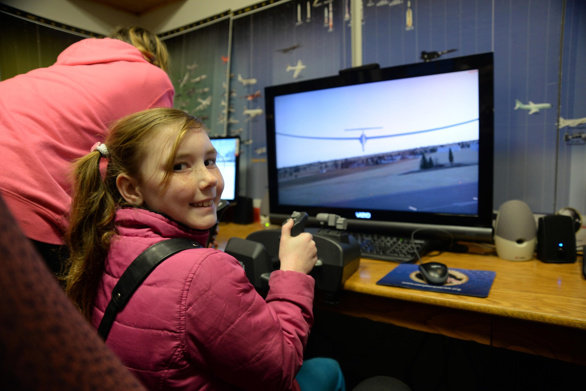Julianna Gorton, daughter of retired U.S. Air Force Master Sgt. Richard Gorton and Aime Gorton, hones her glider skills at the Curtis E. LeMay Composite Squadron's open house March 30 at their squadron headquarters. The event showcased a new state-of-the-art cybersecurity and science, technology, engineering and mathematics (STEM) learning environment made possible by grants from a local corporate sponsor, the Offutt Officers’ Spouses’ Club and an anonymous donor.

About 56,000 members make up CAP, which celebrated 75 years of service on Dec. 1, 2016, and consists of eight geographical regions, composed of 52 separate wings, one in each state, and Washington D.C. and Puerto Rico. The organization operates a fleet of 550 aircraft and performs about 90 percent of continental U.S. inland search and rescue missions as tasked by the Air Force Rescue Coordination Center. CAP is credited with saving an average of 78 lives every year.