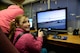 Julianna Gorton, daughter of retired U.S. Air Force Master Sgt. Richard Gorton and Aime Gorton, hones her glider skills at the Curtis E. LeMay Composite Squadron's open house March 30 at their squadron headquarters. The event showcased a new state-of-the-art cybersecurity and science, technology, engineering and mathematics (STEM) learning environment made possible by grants from a local corporate sponsor, the Offutt Officers’ Spouses’ Club and an anonymous donor.

About 56,000 members make up CAP, which celebrated 75 years of service on Dec. 1, 2016, and consists of eight geographical regions, composed of 52 separate wings, one in each state, and Washington D.C. and Puerto Rico. The organization operates a fleet of 550 aircraft and performs about 90 percent of continental U.S. inland search and rescue missions as tasked by the Air Force Rescue Coordination Center. CAP is credited with saving an average of 78 lives every year.
