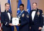 Master Sgt. Tamica Hales, 502nd Air Base Wing superintendent of chapel operations, is awarded the 2016 Gerald Cullins Award for the best chaplain's assistant in the Air Force, noncomissioned officer category, March 29, 2017, at the Air Force Chaplains Annual Award ceremony at the Hilton Hotel in San Antonio. The ceremony was part of a three-day chaplains corps conference, which included days of presentations from leaders in the field of divinity, science and psychology. The conference served as a way for chaplains and chaplain’s assistants to share ideas and programs throughout the force. (U.S. Air Force photo by Staff Sgt. Marissa Garner)