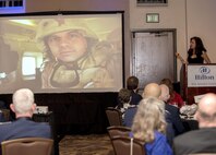Ginger Gilbert Ravella speaks about her experience of having her faith tested after her husband, U.S. Air Force Maj. Troy Gilbert, was killed in Iraq in 2006 during the Air Force Chaplains Annual Award ceremony at the Hilton Hotel in San Antonio March 29, 2017. Ginger spoke about how Air Force chaplains helped her through a dark period in her life while she was trying to figure out how she would raise their five children and stay faithful to God. When Gilbert was killed, insurgents stole his body before U.S. soldiers could reach the crash site, and 10 years passed before he was fully recovered and laid to rest Dec. 19 at Arlington National Cemetery. Ginger is now a motivational speaker and seeks to keep her husband’s memory alive through telling their story. (U.S. Air Force photo by Staff Sgt. Marissa Garner)