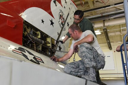 U.S. Airmen from the Colorado Air National Guard, Crash Damage Disabled Recovery Team, work to remove the vertical tail from the fuselage of a damaged Thunderbird F-16, Peterson Air Force Base (AFB), Colo., March 14, 2017. 