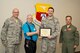 U.S. Air Force Reserve Chief Master Sgt. Paul Stewart, superintendent, 913th Airlift Group, Jerry Reichenbach, the President of the Air Force Association of Arkansas, Capt. Casey Staheli, public affairs officer, 913 AG and Col. Anthony Brusca, interim commander for the 913 AG, pose for a photo at Little Rock Air Force Base, Ark., April 3, 2017. Staheli was presented the 2016 Airman of the Year award for the 913 AG from the Arkansas Chapter of the AFA. (U.S. Air Force photo by Master Sgt. Jeff Walston/Released)