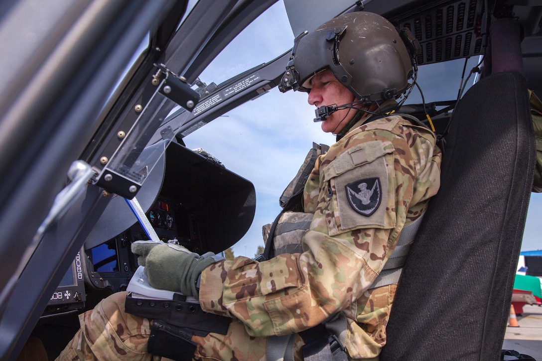 Georgia Army National Guard Chief Warrant Officer 4 L. Bayne Walker prepares to takeoff in a UH-72 Lakota helicopter during aerial firefighting exercise Operation Vigilant Guard in Ellabell, Ga., March 29, 2017. Walker is a pilot assigned to Detachment 1 Charlie Company, 2nd Battalion, 151st Service and Support. Army photo by Spc. Jesse Coggins 