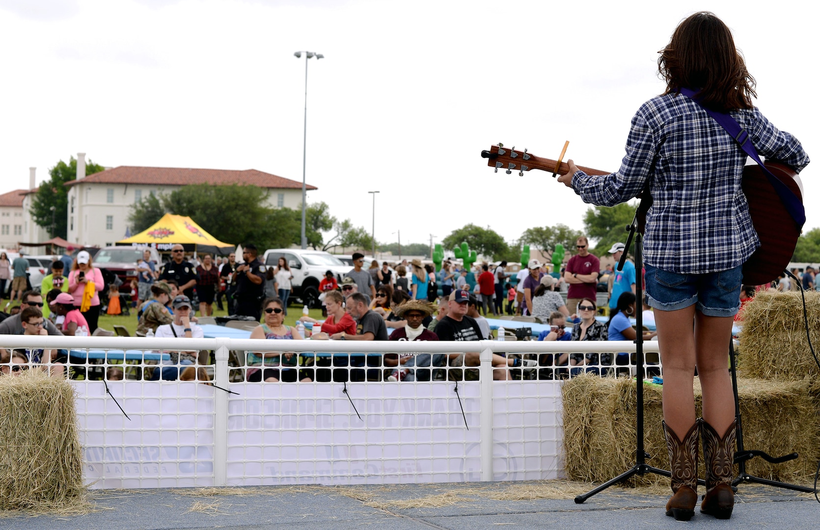 Malia A. Barker sings and entertains the crowd during the Cowboys for Heroes event Joint Base San Antonio-Fort Sam Houston’s MacArthur Parade Field April 1.