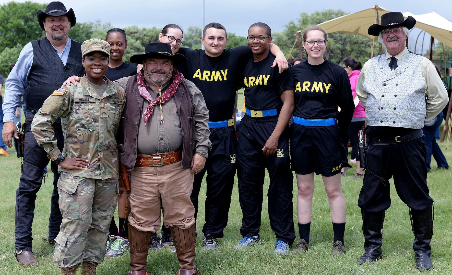Soldiers from 187th Medical Battalion Company B and 264th Medical Battalion Company B interact with members of the Chuck Wagon Cuisine during the Cowboys for Heroes event Joint Base San Antonio-Fort Sam Houston’s MacArthur Parade Field April 1.