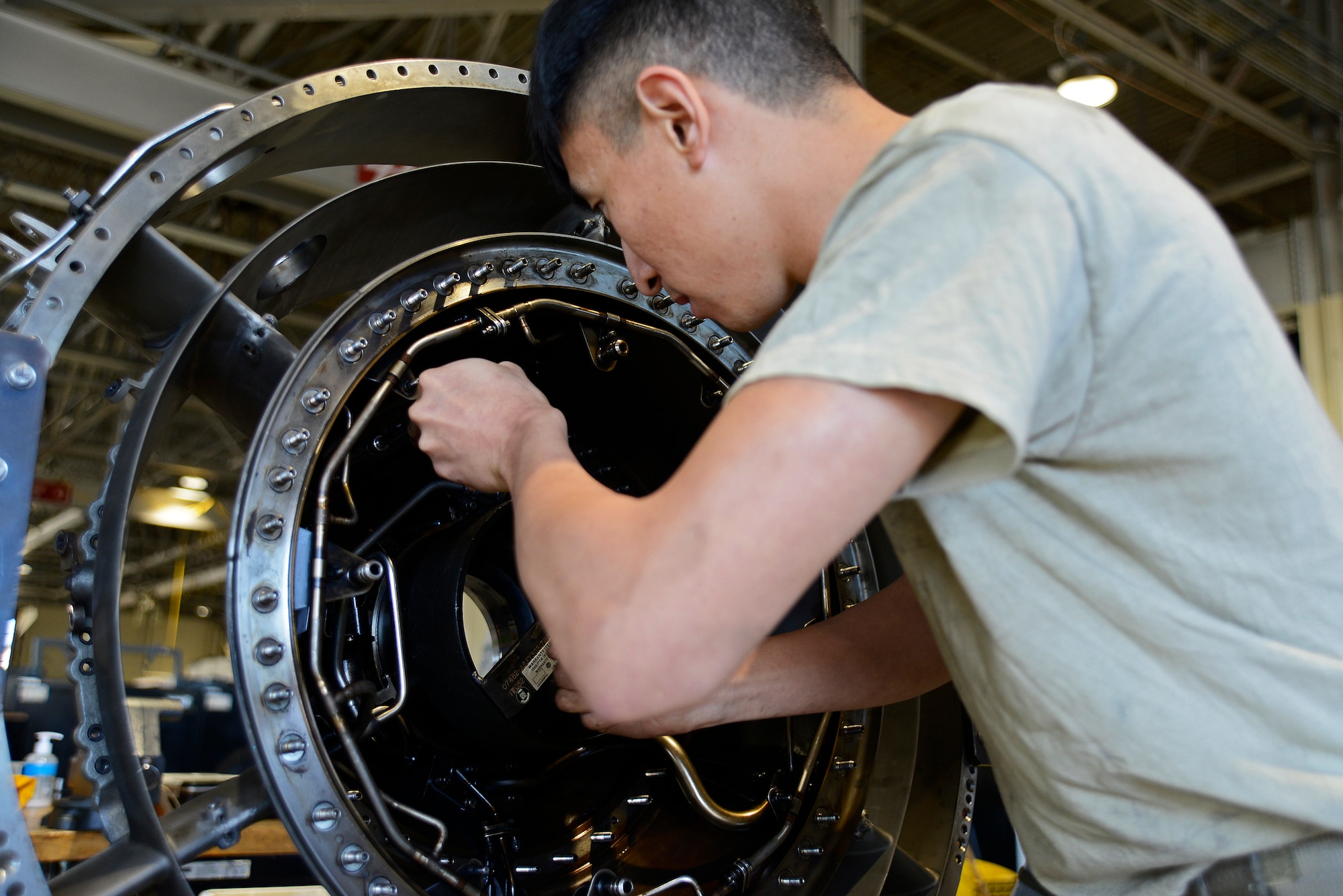 U.S. Air Force Senior Airman Monhuan Lee, 20th Component Maintenance Squadron aerospace propulsion journeyman, tightens a bolt on a fan frame at Shaw Air Force Base, S.C., March 29, 2017. The fan frame makes up part of the F110-129D engine as a support fan. (U.S. Air Force photo by Airman 1st Class BrieAnna Stillman)