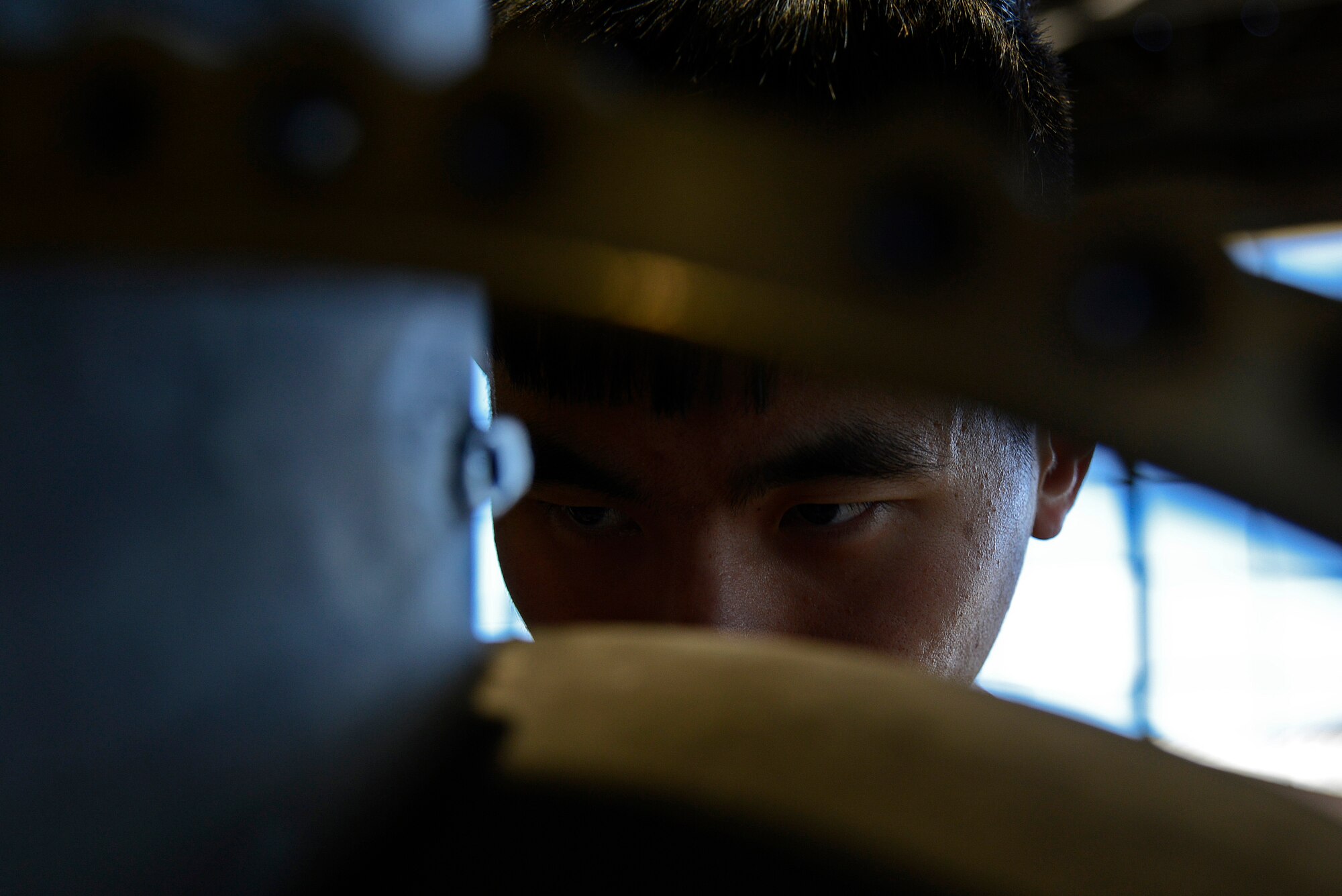 U.S. Air Force Senior Airman Monhuan Lee, 20th Component Maintenance Squadron aerospace propulsion journeyman works on the number three sump housing, which houses part of the F110-129D engine at Shaw Air Force Base, S.C., March 29, 2017. The number three sump housing is one of five sump housings that will be used when reassembling the F110-129D engine. (U.S. Air Force photo by Airman 1st Class BrieAnna Stillman)
