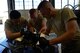 U.S. Air Force Airman 1st Class Jesus Ortega 20th Component Maintenance Squadron (CMS) aerospace propulsion journeyman, left, Airman 1st Class Caleb Gulley, center, and Airman 1st Class Andrew Setrin, right, 20th CMS aerospace propulsion apprentices, work together on the number two sump housing at Shaw Air Force Base, S.C., March 29, 2017. The number two sump housing works with the number three sump housing as the support fan and core compressor rotors for the F110-129D engine. (U.S. Air Force photo by Airman 1st Class BrieAnna Stillman)