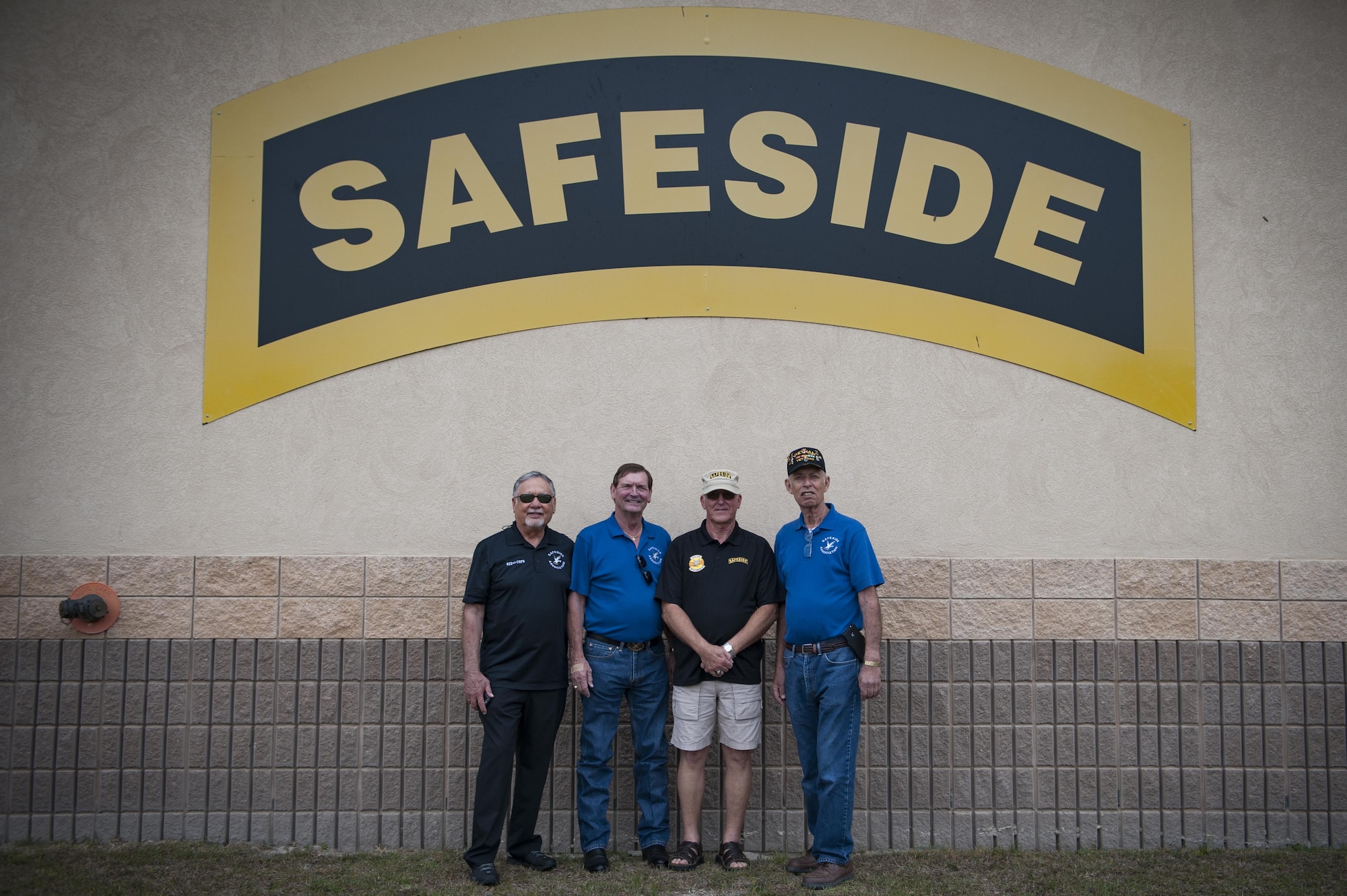 Former members of the 820th Base Defense Group pose for a photo during the 820th BDG anniversary, March 27, 2017, at Moody Air Force Base, Ga. The anniversary commemorated 20 years since the activation of the 820th BDG and allowed guests to reminisce on their history, honor those they’ve lost, and witness a tactical demonstration. (U.S. Air Force photo by Airman 1st Class Lauren M. Sprunk)