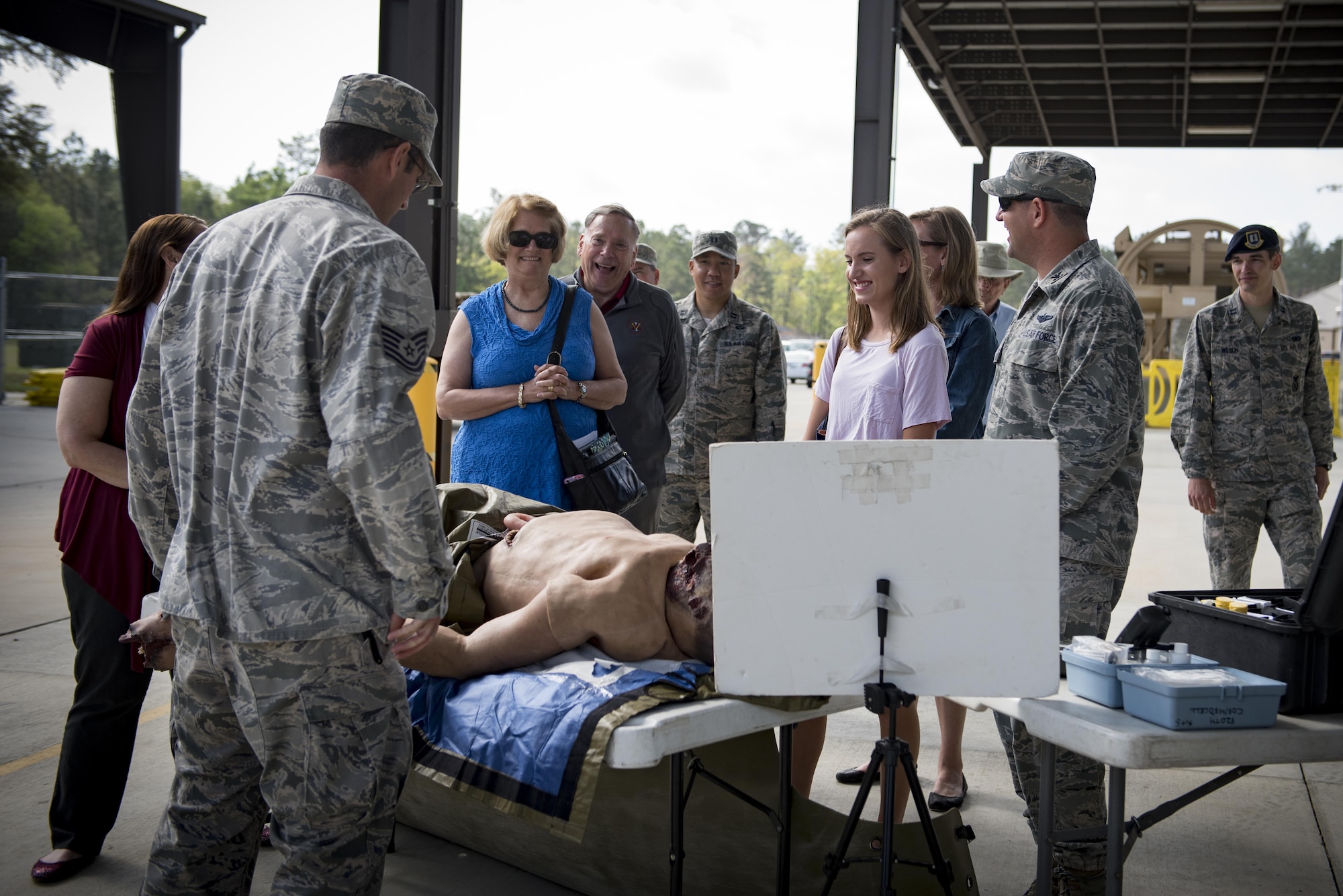 Guests observe a medical training display during the 820th Base Defense Group anniversary, March 27, 2017, at Moody Air Force Base, Ga. The anniversary commemorated 20 years since the activation of the 820th BDG and allowed guests to reminisce on their history, honor those they’ve lost, and witness a tactical demonstration. (U.S. Air Force photo by Airman 1st Class Lauren M. Sprunk)