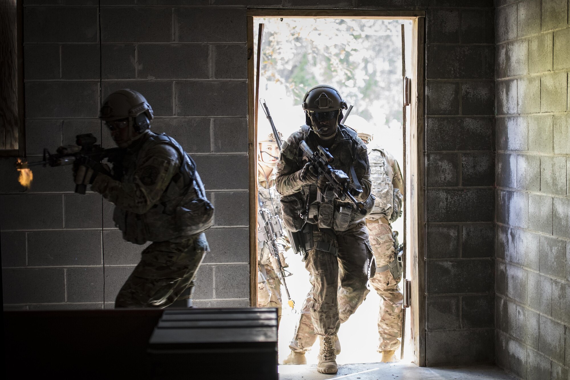 Airmen from the 820th Base Defense Group ambush a building during a tactical demonstration, March 27, 2017, at Moody Air Force Base, Ga. The demonstration was part of the 820th BDG anniversary, which commemorated 20 years since the activation of the 820th BDG and allowed guests to reminisce on their history, honor those they’ve lost, and witness a tactical demonstration. (U.S. Air Force photo by Airman 1st Class Lauren M. Sprunk)