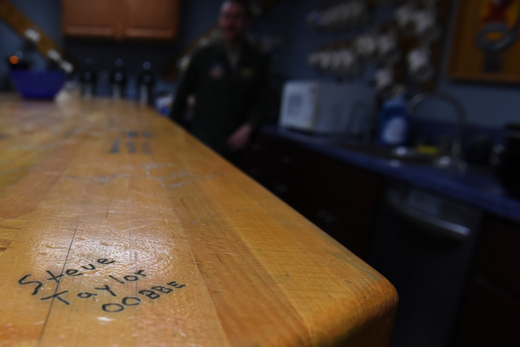 Lt. Col. Stephen Taylor’s, 334th Fighter Squadron assistant director of operations, signature is etched on a table he constructed for the squadron, March 30, 2017, at Seymour Johnson Air Force Base, North Carolina. Taylor reached 3,000 flight hours in the F-15E Strike Eagle and both started and ended his career at Seymour Johnson AFB. (U.S. Air Force photo by Airman 1st Class Victoria Boyton) 