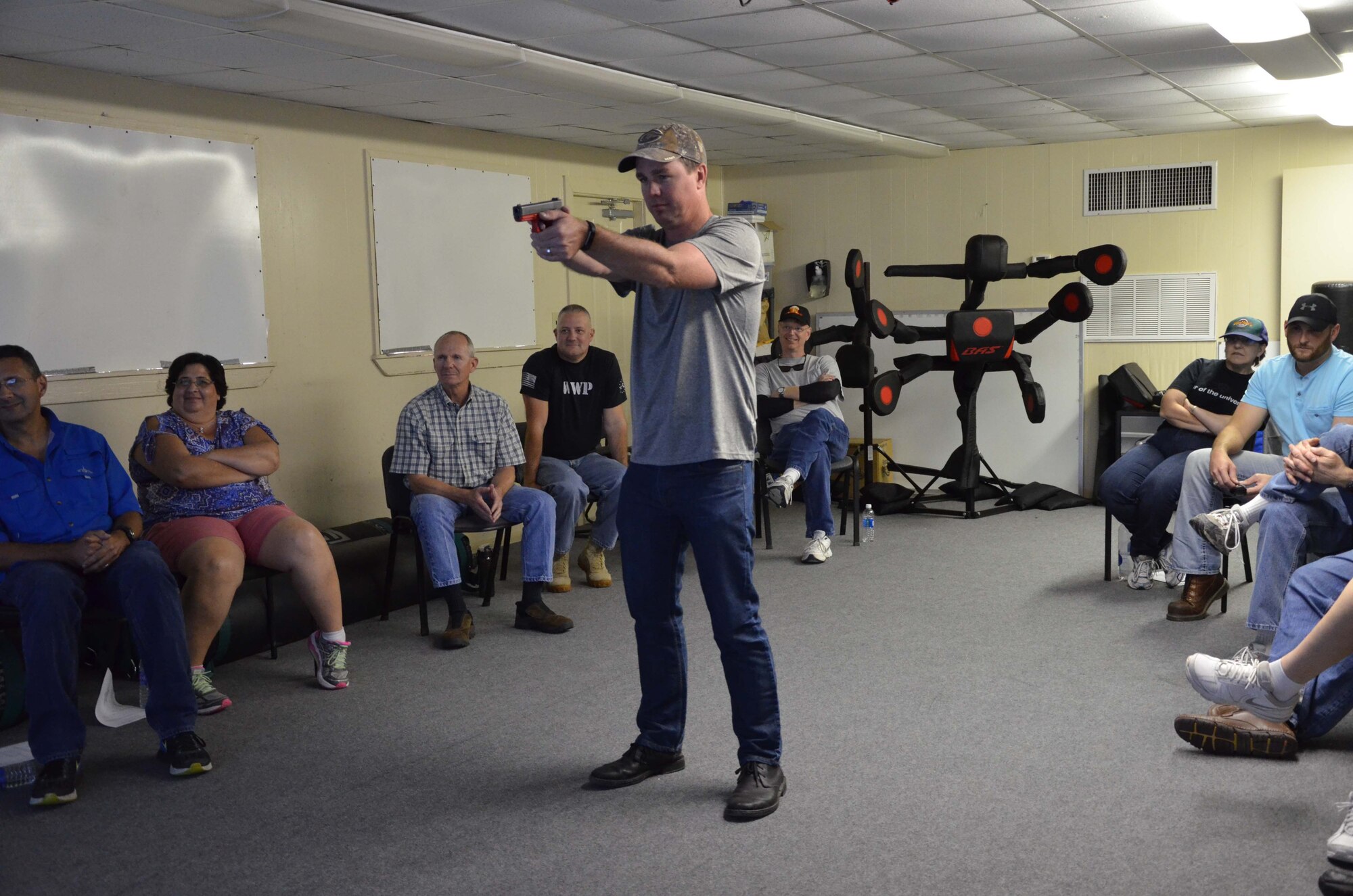 Col. Steven M. Gorski, commander of the Air Force Technical Applications Center, takes aim with a virtual handgun using a MILO simulator at the Brevard County Sheriff’s Office firing range.  Gorski and  24 members of his organization participated in BCSO’s Self Defense Through Tactical Shooting and Decision Making course March 25, 2017.  (U.S. Air Force photo by Susan A. Romano)
