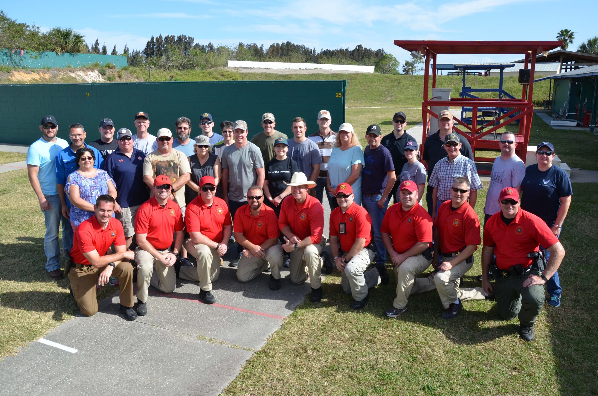 Members of the Air Force Technical Applications Center, Patrick AFB, Fla., and deputies from the Brevard County Sheriff’s Office pose for a group photo after completing BCSO’s Self Defense Through Tactical Shooting and Decision Making course March 25, 2017.  (U.S. Air Force photo by Susan A. Romano)