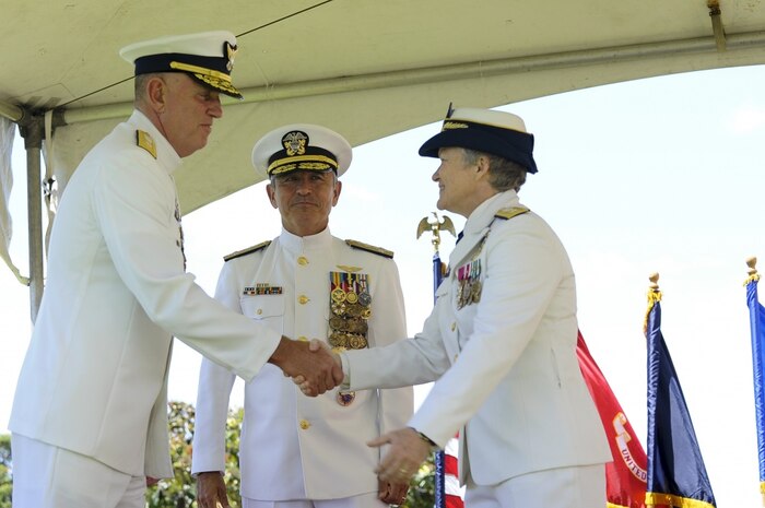 U.S. Coast Guard Rear Adm. Keith M. Smith welcomes Rear Adm. Donna L. Cottrell, USCG (center, Commander U.S. Pacific Command, Adm. Harry Harris, Jr., USN) during Joint Interagency Task Force West's 17th Change of Command Ceremony at Camp H. M. Smith, March 31, 2017. 