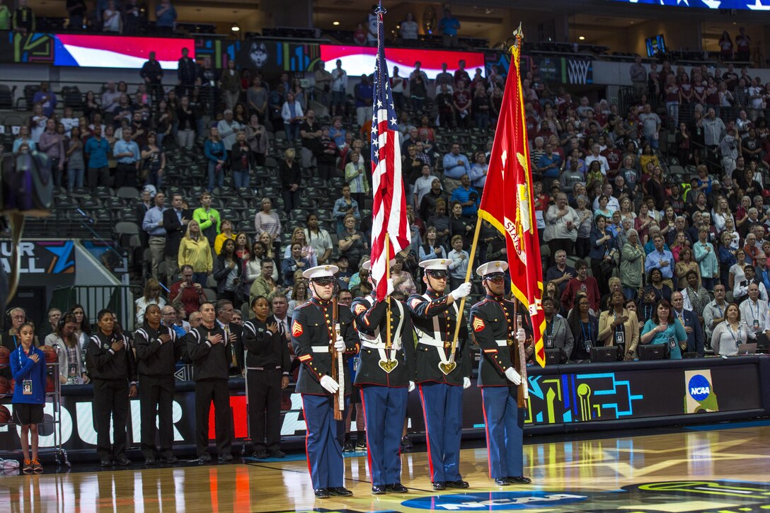 U.S. Marines with Recruiting Station Dallas, march on the colors during the 2017 NCAA Women’s Final Four Basketball Championship on March 31, 2017.