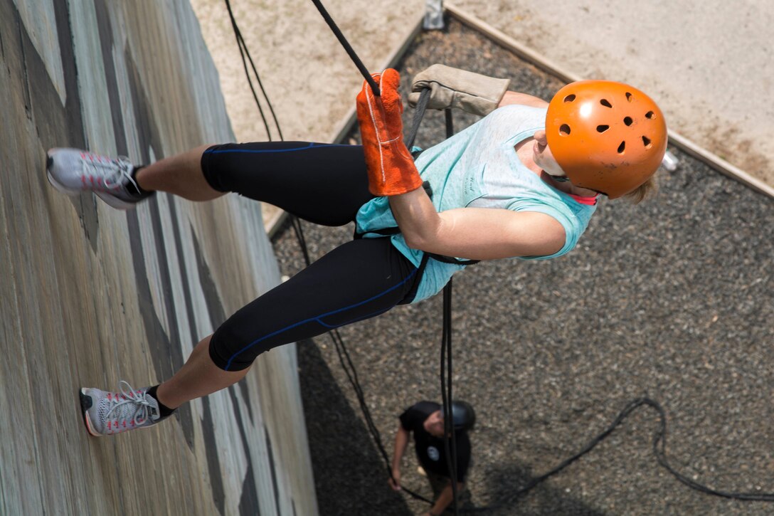 Billie Bruchlous, an English teacher at Kinder High School, descends the repel tower during the Recruiting Station Baton Rouge and Jacksonville Educators Workshop aboard Marine Corps Recruit Depot Parris Island, South Carolina, Mar. 30, 2017. The Educators come from Louisiana, Georgia, Mississippi, Florida, and South Carolina to experience this workshop. The workshop allows educators to have an inside look at educational benefits and career opportunities in the Marine Corps to better inform their students. (U.S. Marine Corps photo by Lance Cpl. Jack A. E. Rigsby/Released)