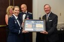 SCHRIEVER AIR FORCE BASE, Colo. -- 310th Bombardment Group alumni member, Lt. Bernard &quot;Bernie&quot; Peters accepts a token of appreciation from Col. Traci Kueker-Murphy, 310th Space Wing commander, at the wing&#39;s 19th Annual Awards Banquet Saturday, Apr. 1st, 2017. The 310th Space Wing boasts a proud heritage that ties back to the Doolittle Raiders, who were members of the 310th Bombardment Group. (U.S. Air Force photo/Senior Airman Laura Turner)