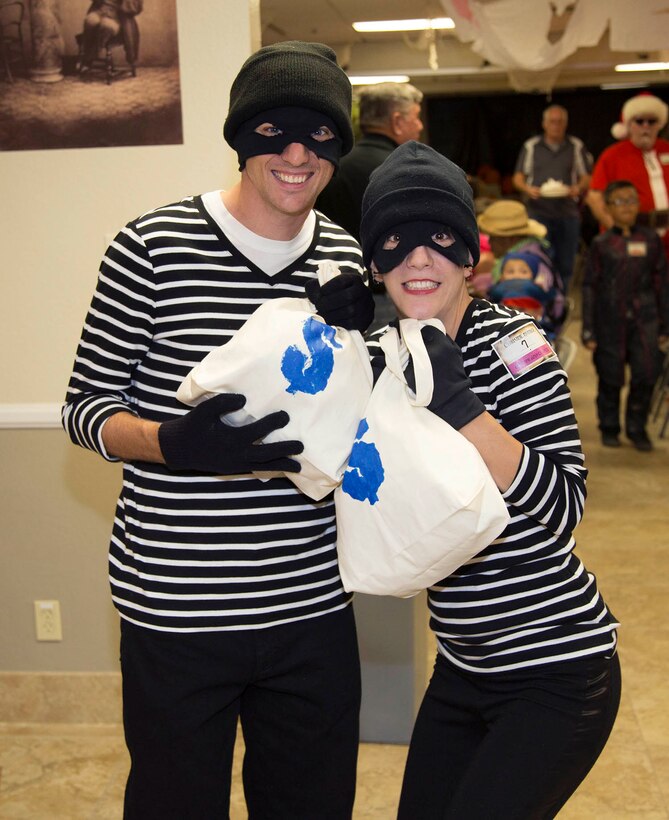 Capt. Adam and Miriam Hemme, dressed as theives, were caught in the act of snatching candy during the 2015 Halloween Haunt held at the Gen. James L. Day Conference Center, aboard MCLB Barstow, Oct. 29.