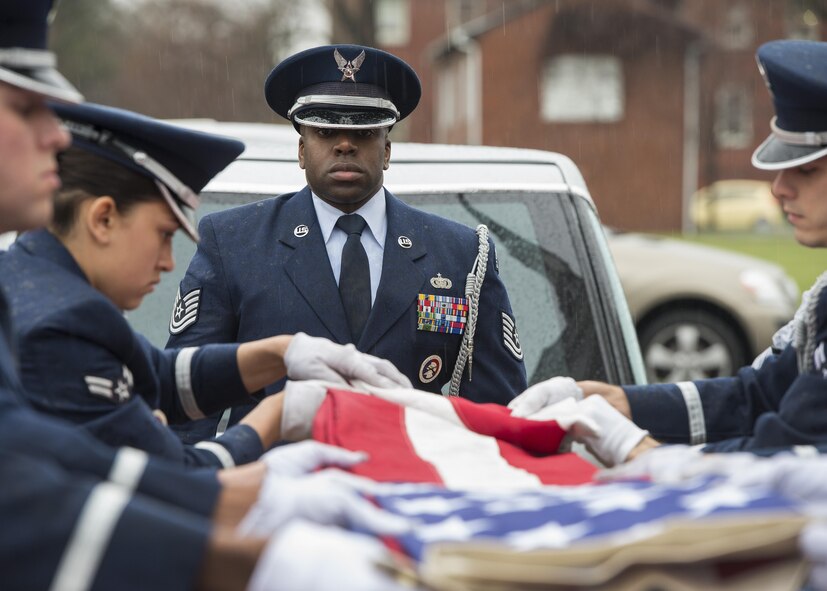 Tech. Sgt. Isaiah Martin, NCO in charge of the Dover Air Force Base Honor Guard, oversees an Honor Guard team’s duties during the funeral service of retired Maj. John L. Harrison, Jr., World War II veteran and Tuskegee Airman, March 31, 2017, at the Chapel of the Four Chaplains at the Navy Yard in Philadelphia, Pa. The Tuskegee Airmen are a group of African-American military pilots who fought in World War II. (U.S. Air Force photo by Senior Airman Zachary Cacicia)