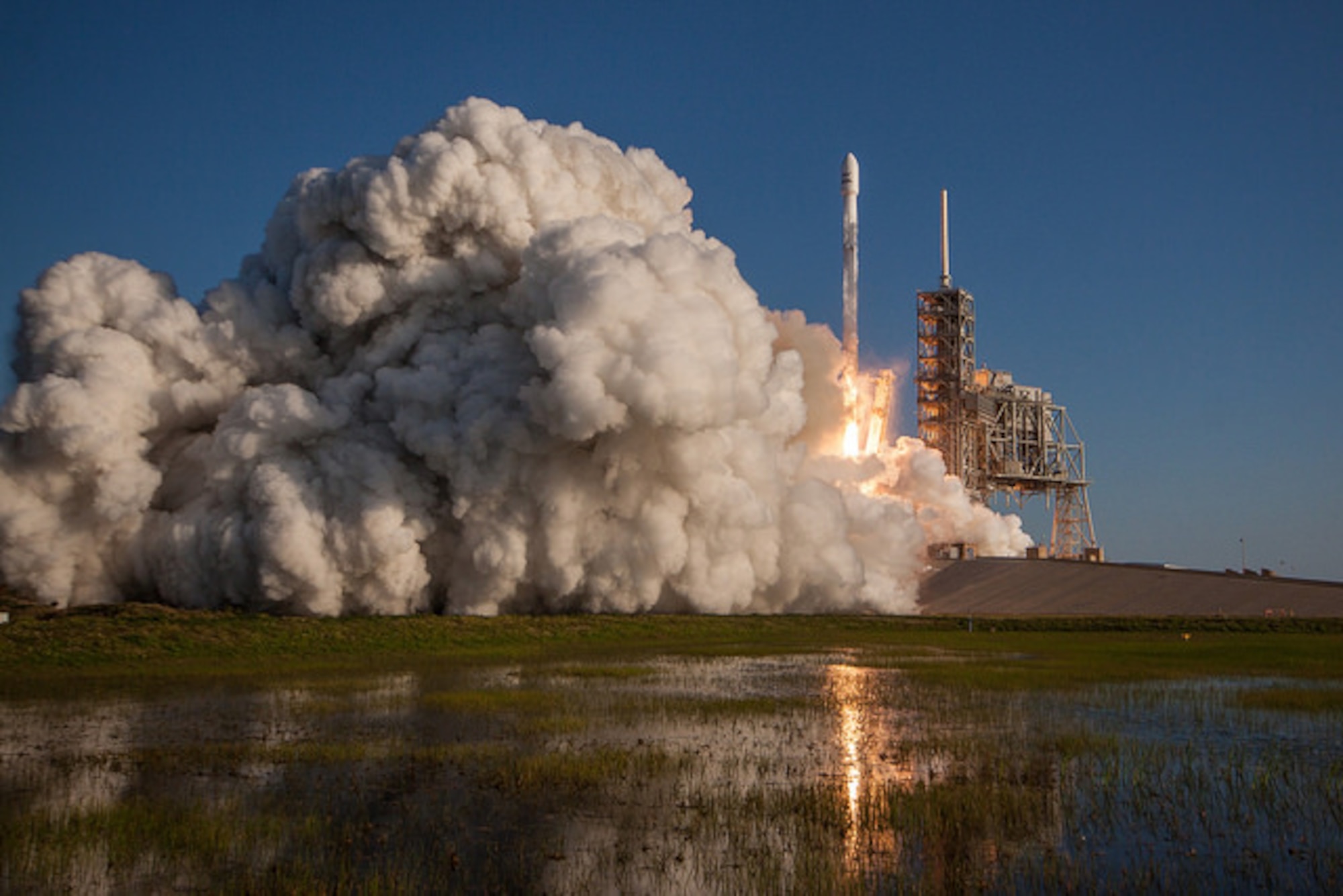 SpaceX made history March 30, 2017 with the successful launch of a reused Falcon 9 rocket from Launch Complex 39A (LC-39A) at NASA’s Kennedy Space Center in Florida at 6:27 p.m. EDT. One hour prior to the milestone launch, Citizen Airmen from the 920th Rescue Wing were clearing the box beneath the rocket’s path in an HH-60G Pave Hawk helicopter ensuring no mariners were in harm’s way prior to launch. (Photo courtesy Spacex)
