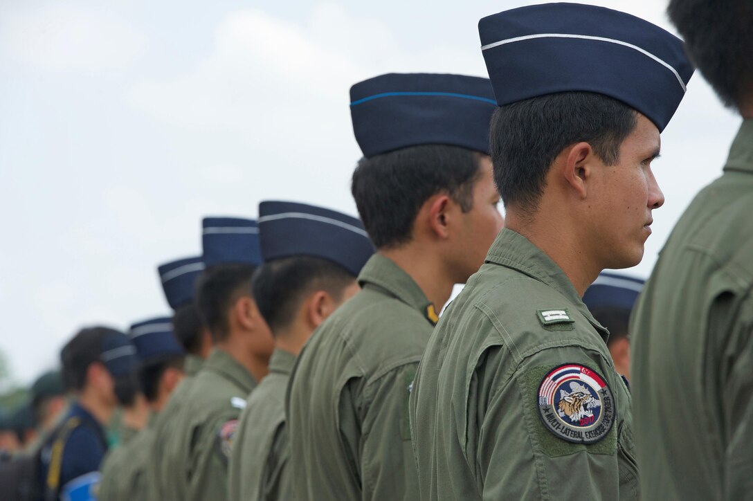 Royal Thai air force pilots stand in formation during the closing ceremony for Cope Tiger 17 at Korat Royal Thai Air Force Base, Thailand, March 31, 2017. The annual multilateral exercise is aimed at improving combined combat readiness and interoperability between the Republic of Singapore air force, Royal Thai air force, and U.S. Air Force, while concurrently enhancing the three nations' military relations.  (U.S. Air Force photo by Staff Sgt. Kamaile Chan)