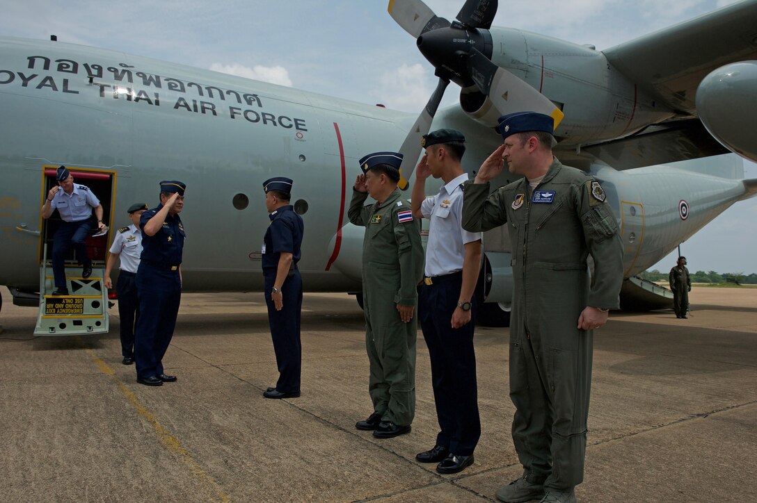 Royal Thai air force (RTAF) Air Chief Mashal Surasak Toongtong, Chief of the Air Staff for the RTAF, Republic of Singapore air force (RSAF) Maj. Gen. Mervyn Tan Wei Ming, Chief of the Air Force for the RSAF and U.S. Air Force Maj. Gen. James Eifert, Air National Guard assistant to the Commander, Pacific Air Forces are greeting by Cope Tiger exercise directors after arriving for the closing ceremony for Cope Tiger 17 at Korat Royal Thai Air Force Base, Thailand, March 31, 2017. The annual multilateral exercise is aimed at improving combined combat readiness and interoperability between the Republic of Singapore air force, Royal Thai air force, and U.S. Air Force, while concurrently enhancing the three nations' military relations.  (U.S. Air Force photo by Staff Sgt. Kamaile Chan)