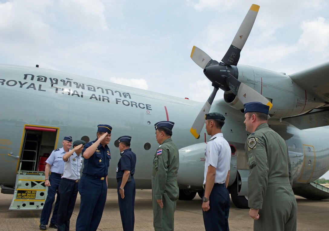 Royal Thai air force (RTAF) Air Chief Mashal Surasak Toongtong, Chief of the Air Staff for the RTAF, Republic of Singapore air force (RSAF) Maj. Gen. Mervyn Tan Wei Ming, Chief of the Air Force for the RSAF and U.S. Air Force Maj. Gen. James Eifert, Air National Guard assistant to the Commander, Pacific Air Forces are greeting by Cope Tiger exercise directors after arriving for the closing ceremony for Cope Tiger 17 at Korat Royal Thai Air Force Base, Thailand, March 31, 2017. The annual multilateral exercise is aimed at improving combined combat readiness and interoperability between the Republic of Singapore air force, Royal Thai air force, and U.S. Air Force, while concurrently enhancing the three nations' military relations.  (U.S. Air Force photo by Staff Sgt. Kamaile Chan)