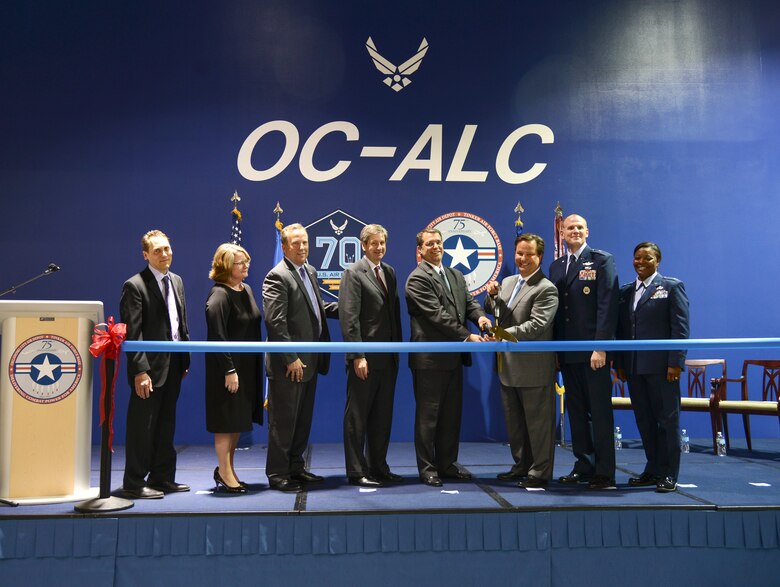 A ribbon cutting ceremony was held at Bldg. 3001’s Hollywood and Vine area March 29, marking the beginning of a $243 million facility modernization project between the Oklahoma City Air Logistics Complex and Honeywell. The largest energy savings contract in Air Force history is projected to save $626 million in energy and operational costs over 21 years. Participating in the ribbon cutting ceremony are, from left, Joseph Cecrle, 76th Maintenance Support Group, Engineering Branch; Kelley Butler, director of the 76th Maintenance Support Group; Ken Madden, vice president and general manager of service groups for Honeywell; Mark Correll, deputy assistant secretary of the Air Force for Environment, Safety and Infrastructure; Terrence Hahn, president and CEO of home and building technologies for Honeywell; Wade Wolfe, vice director for the Oklahoma City Air Logistics Complex; Brig. Gen. Martin Chapin; and Col. Stephanie Wilson, commander of the 72nd Air Base Wing. (Air Force photo by Kelly White)