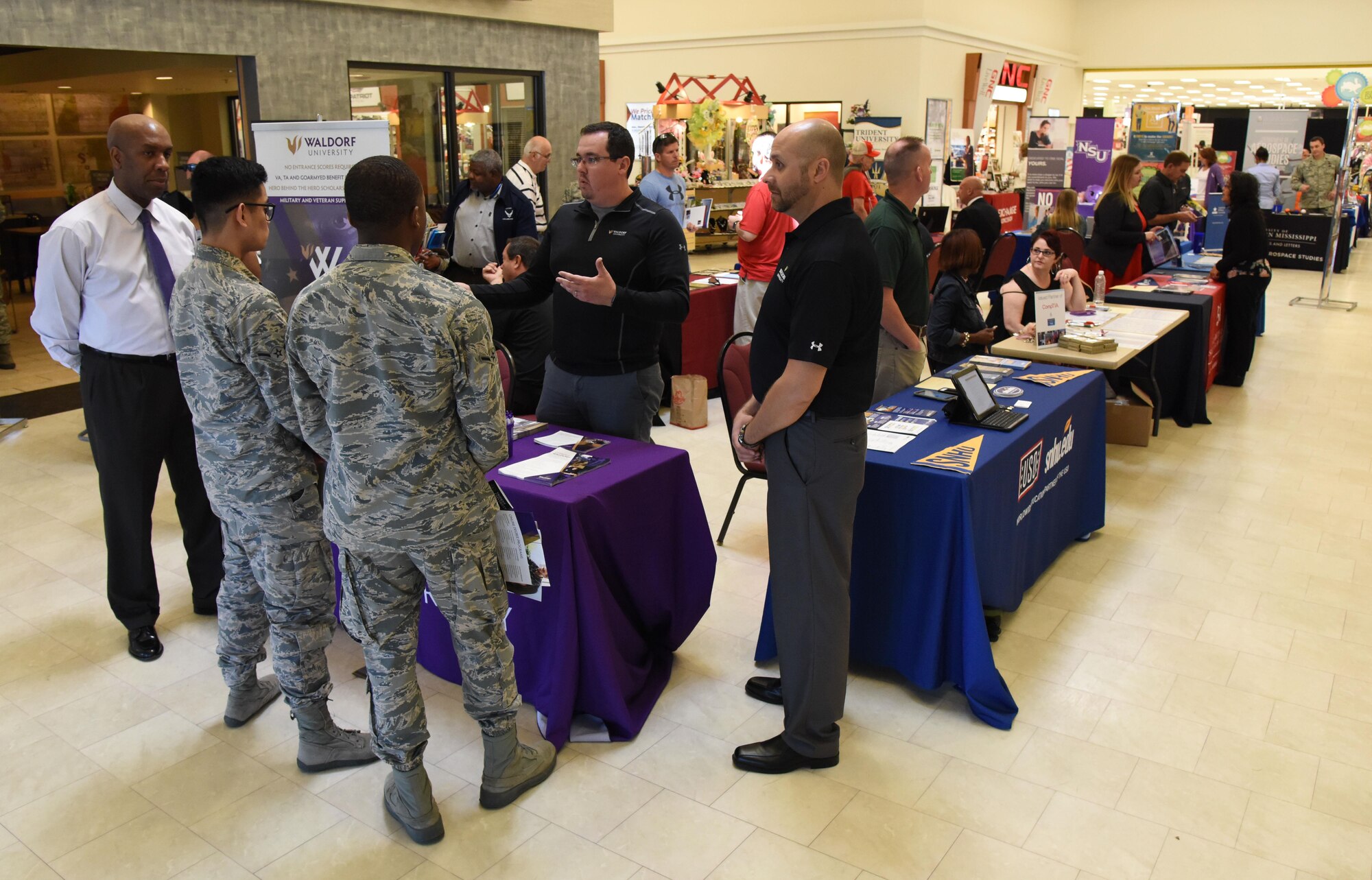 Keesler personnel attends the Spring Education Information Fair at the base exchange, March 29, 2017, on Keesler Air Force Base, Miss. The Keesler Education Services’ staff hosted more than 25 community colleges and universities at the event. (U.S. Air Force photo by Kemberly Groue)