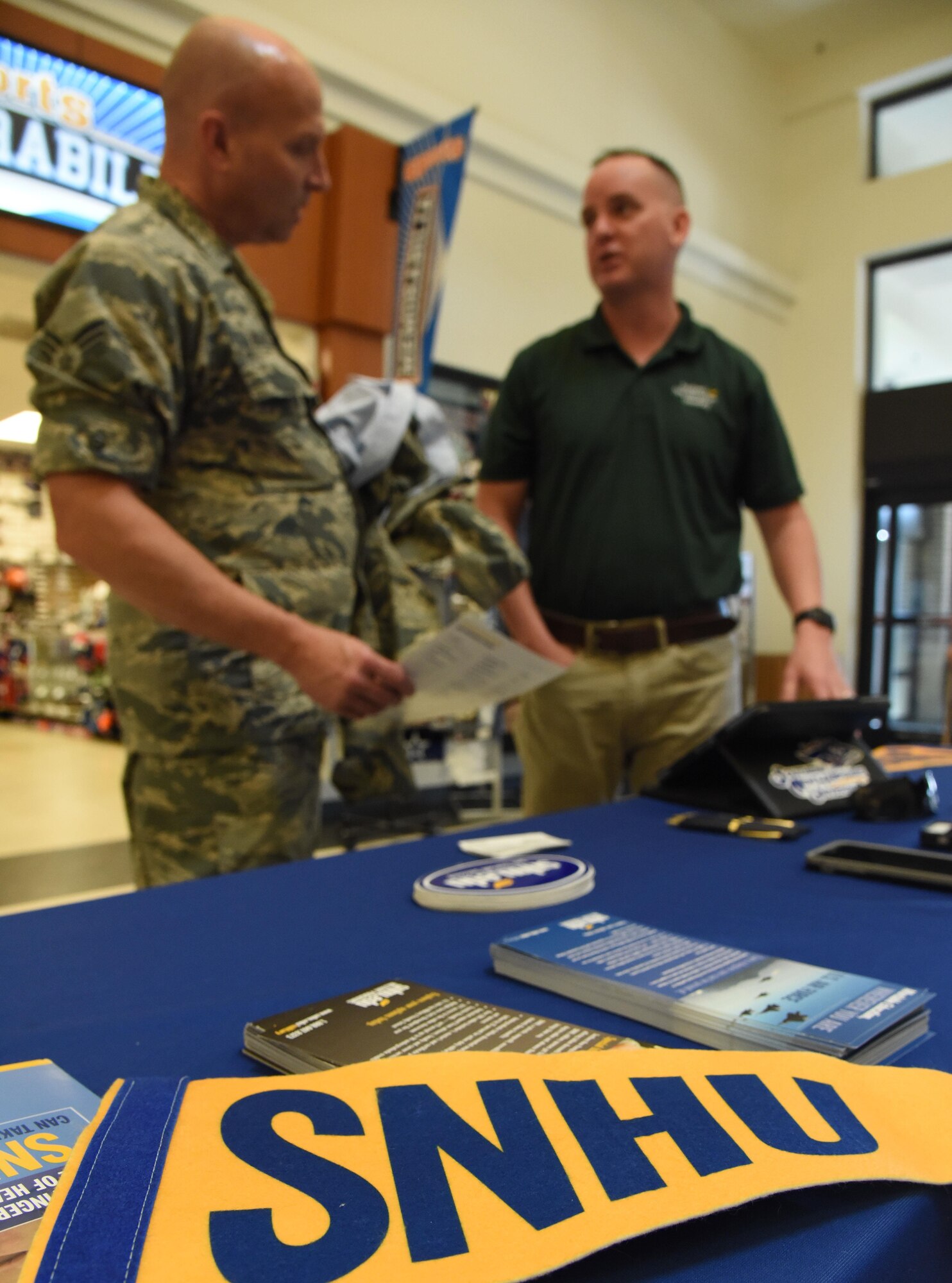 A Southern New Hampshire University  flag and brochures sit on display during the Spring Education Information Fair at the  base exchange , March 29, 2017, on Keesler Air Force Base, Miss. The event is held to allow Keesler personnel the opportunity to explore higher education options. (U.S. Air Force photo by Kemberly Groue)