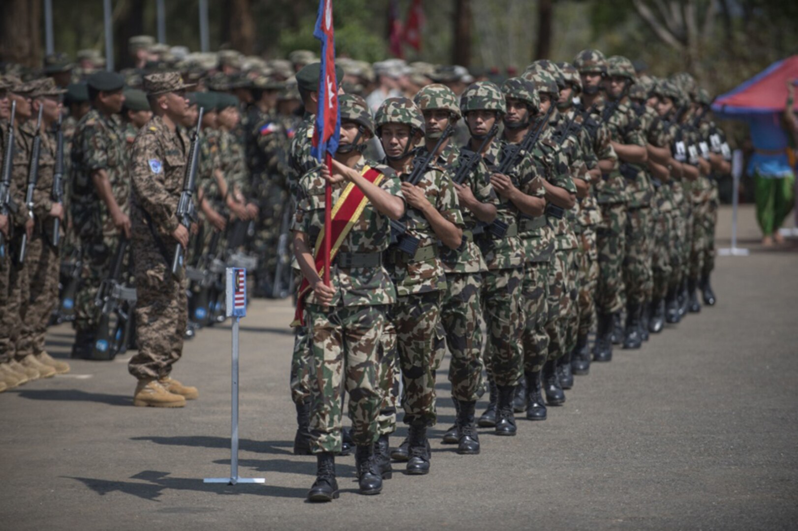 Nepalese soldiers parade their colors in the closing ceremony during exercise Shanti Prayas III in Nepal, April 3, 2017. Shanti Prayas is a multinational United Nations peacekeeping exercise designed to provide pre-deployment training to U.N. partner countries in preparation for real-world peacekeeping operations. 