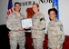 Tech. Sgt. Ashley Hall, 42nd Aerospace Medicine Squadron dental technician, receives a certificate of promotion from Col. Eric Shafa, 42nd Air Base Wing Commander, and Chief Master Sgt. Erica Shipp, 42nd Air Base Wing Command Chief, April 3, 2017, Maxwell Air Force Base, Ala. Hall was selected for step promotion due to her exemplary performance as a non-commissioned officer. (U.S. Air Force photo/ Senior Airman Alexa Culbert)