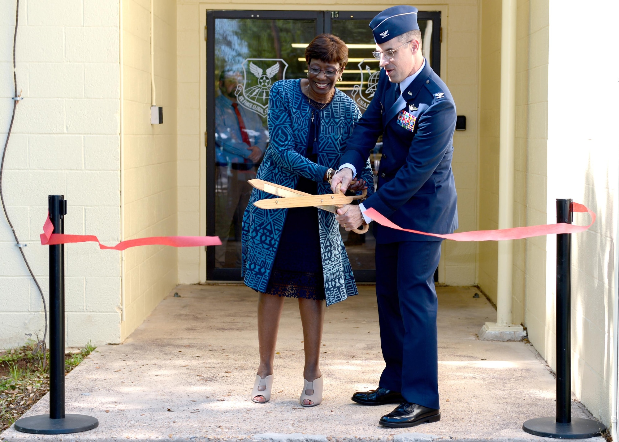 Col. Mark Jablow, Air Force Command, Control and Communications Center commander and The Honorable Ollie Tyler, Shreveport mayor, cut the inauguration ribbon as part of an activation of command ceremony at Barksdale Air Force Base, La., April 3, 2017.  The U.S. Air Force Nuclear Command, Control and Communication Center streamlines the management of approximately 62 different systems and forms a single NC3 point of contact and advocate for the entire Air Force. (U.S. Air Force Photo/Senior Airman Mozer O. Da Cunha)