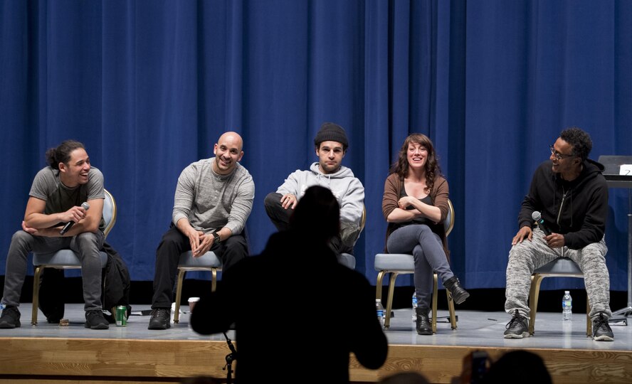 An audience member talks with actors during a Q-and-A session after a performance of, “Jesus Hopped The ‘A’ Train,” March 20, 2017, at Yokota Air Base, Japan. Over 120 members of Yokota participated in the event. (U.S. Air Force photo by Airman 1st Class Donald Hudson)