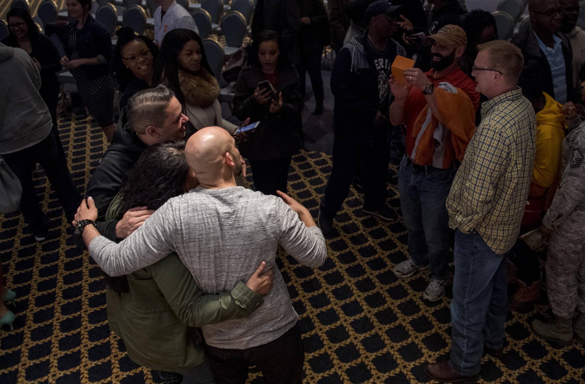 Victor Almanzar poses for photo with audience members after a performance of, “Jesus Hopped The ‘A’ Train,” March 20, 2017, at Yokota Air Base, Japan. Over 120 members of Yokota participated in the event. (U.S. Air Force photo by Airman 1st Class Donald Hudson)