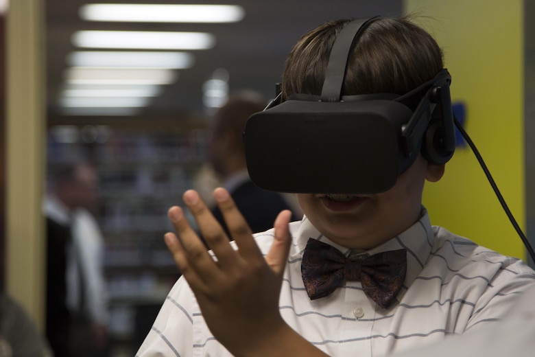 CAMP FOSTER, OKINAWA, Japan— A child interacts with virtual objects using an Oculus Rifts March 27 during the grand opening of the Innovation Lab at the Camp Foster Library, Okinawa, Japan. The Innovation Lab features two Oculus Rifts, 3-D printers and an interactive robot. It’s open to everyone and meant for all skill levels.  (U.S. Marine Corps photo by Cpl. Jessica Collins)