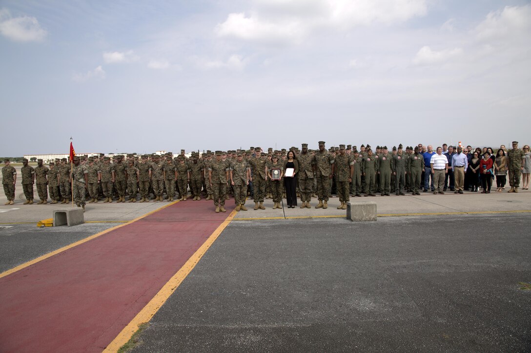 MCAS FUTENMA, OKINAWA, Japan— Headquarters and Headquarters Squadron poses for a group photo March 29 after an award ceremony on Marine Corps Air Station Futenma. During the ceremony, Headquarters and Headquarters Squadron received the 2016 National Defense Transportation Association Military Unit of the Year Award for their outstanding service in the field of transportation and logistics. H&HS went head-to-head against the other branches of service for this award and came out on top.  (U.S. Marine Corps photo by Cpl. Jessica Collins)