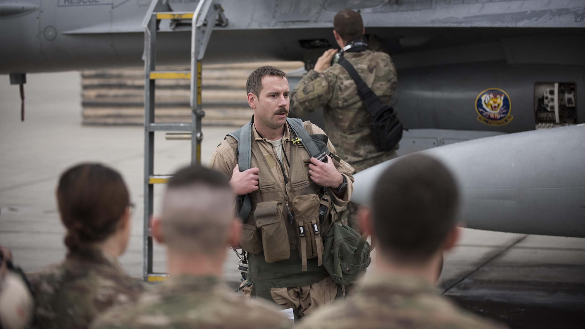 Lt. Col. Craig Andrle, 79th Expeditionary Fighter Squadron commander, speaks to squadron members after flying his 1,000th combat hour March 20, 2017 at Bagram Airfield, Afghanistan. There are only four F-16 Fighting Falcon pilots, lieutenant colonel and below, currently serving in the Air Force who have reached 1,000 combat hours. (U.S. Air Force photo by Staff Sgt. Katherine Spessa)