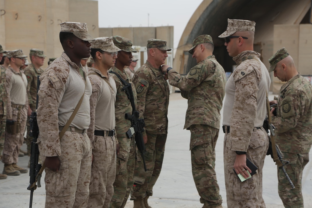 U.S. Army Lt. Gen. Stephen J. Townsend, Combined Joint Task Force - Operation Inherent Resolve commanding general, presents U.S. military personnel deployed in support of Combined Joint Task Force – Operation Inherent Resolve, with the Joint Service Commendation Medal and the Navy Commendation Medal in Iraq, March 1, 2017. The awards were presented to each service member for their contribution to improving the capabilities of the base’s operations. Task Force Al-Taqaddum trains Iraqi forces, an integral aspect of Combined Joint Task Force - Operation Inherent Resolve, the global coalition to defeat ISIS in Iraq and Syria. (U.S. Marine Corps photo by Lance Cpl. Joshua McAlpine) 