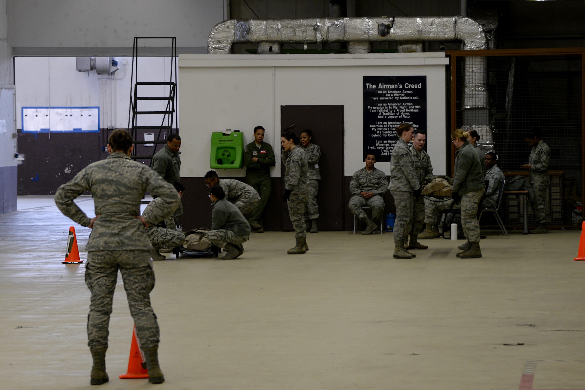 Staff Sgt. Jordan Hebner, 86th Dental Squadron dental technician, oversees litter carry training during an 86th Medical Group training day on Ramstein Air Base, Germany, March 22, 2017. Litter carries are a means of manually transporting patients from one area to another. (U.S. Air Force photo by Airman 1st Class D. Blake Browning)