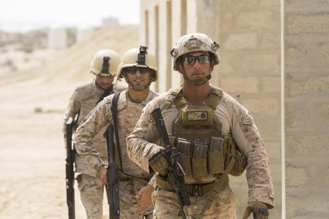 Staff Sgt. John Williams, the platoon sergeant of Weapons Company, 3rd Battalion, 7th Marine Regiment, Special Purpose Marine Air-Ground Task Force-Crisis Response-Central Command, and Marines with the Royal Saudi Naval Forces, lead an assault team to clear a building during a squad attack exercise, March 9, 2017. The training proved to be an enhancing opportunity for both the U.S. and Saudi Marines. Deploying U.S. Marines into the U.S. Central Command area of responsibility to conduct combined military training with our partner nations’ security forces strengthens our vital relationships with partners in this important region. (U.S. Marine Corps photo by Cpl. Christopher Thompson) 