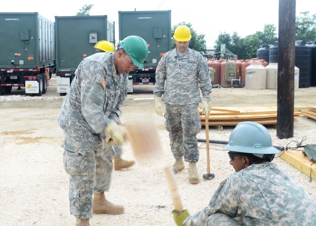 Spc. Dariel Morales with the 471st Engineer Company (Vertical), an Army Reserve unit from Guaynabo, Puerto Rico, pounds a stake in the ground while setting up tents in the living quarter’s area for personnel participating in Beyond the Horizon 2017 at Price Barracks, Belize on March 14, 2017. BTH 2017 is a partnership exercise between U.S. Army South and the Belize government that will consist of various medical events and construction projects throughout Belize.